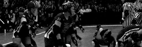 Jammers skating through the pivots and blockers … Queen City Roller Girls